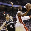 Miami Heat shooting guard Dwyane Wade (3) shoots against San Antonio Spurs shooting guard Danny Green (4) during the second half of Game 6 of the NBA Finals basketball game, Tuesday, June 18, 2013 in Miami. (AP Photo/Lynne Sladky)