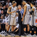 SAN ANTONIO, TX - MAY 21: Mike Budenholzer, assistant coach of the San Antonio Spurs, speaks with Tim Duncan #21 and Kawhi Leonard #2 before resuming play against the Memphis Grizzlies in Game Two of the Western Conference Finals during the 2013 NBA Playoffs on May 21, 2013 at the AT&T Center in San Antonio, Texas. (Photo by Noah Graham/NBAE via Getty Images)