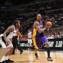 SAN ANTONIO, TX - APRIL 20:  Kobe Bryant #24 of the Los Angeles Lakers moves the ball against Kawhi Leonard #2 of the San Antonio Spurs on April 20, 2012 at the AT&T Center in San Antonio, Texas