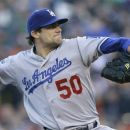 Los Angeles Dodgers pitcher Nate Eovaldi throws against the San Francisco Giants during the first inning of a baseball game in San Francisco, Monday, June 25, 2012. (AP Photo/Jeff Chiu)