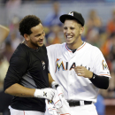 Miami Marlins starting pitcher Henderson Alvarez, left, and Jose Fernandez, right, celebrate Alvarez's no-hitter against the Detroit Tigers after an interleague baseball game on Sunday, Sept. 29, 2013, in Miami. The Marlins won 1-0. (AP Photo/Alan Diaz)