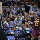 Minnesota's Austin Hollins (20) gestures after a 3-point shot against UCLA during the first half of a second-round game of the NCAA men's college basketball tournament Friday, March 22, 2013, in Austin, Texas. (AP Photo/Eric Gay)