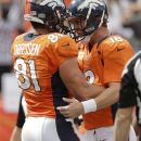Denver Broncos quarterback Peyton Manning (18) celebrates with tight end Joel Dreessen (81) after Dreessen caught a pass for a touchdown against the Oakland Raiders during the first quarter of an NFL football game Sunday, Sept. 30, 2012, in Denver. (AP Photo/Joe Mahoney)