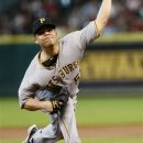 Pittsburgh Pirate Wandy Rodriguez pitches in the bottom of the first inning as the Houston Astros play the Pittsburgh Pirates July 28, 2012 in Houston. (AP Photo/Eric Kayne)