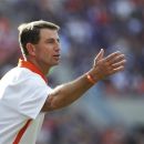 Clemson coach Dabo Swinney gestures to an official during the second half of an NCAA college football game against Furman, Saturday, Sept. 15, 2012, in Clemson, S.C. (AP Photo/Rainier Ehrhardt)