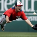 Washington Nationals right fielder Sean Nicol dives but cannot catch a ball hit for an RBI single by Miami Marlins' Greg Dobbs during the sixth inning of an exhibition spring training baseball game Wednesday, March 20, 2013, in Jupiter, Fla. (AP Photo/Jeff Roberson)