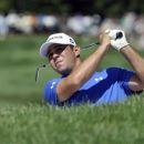 Gary Woodland hits his approach shot on the eighth hole during the fifth annual Notah Begay III Foundation Challenge at Atunyote Golf Club at Turning Stone Resort and Casino in Verona, N.Y., Wednesday, Aug. 29, 2012. (AP Photo/ KevinRivoli)