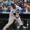 Colorado Rockies' Michael Cuddyer grounds out against the San Francisco Giants in the fourth inning of a baseball game in Denver on Sunday, June 30, 2013. (AP Photo/David Zalubowski)