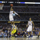 Kansas guard Ben McLemore (23) dunks against Michigan during the second half of a regional semifinal game in the NCAA college basketball tournament, Friday, March 29, 2013, in Arlington, Texas. (AP Photo/Tony Gutierrez)