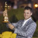 Team Europe golfer Martin Kaymer of Germany holds the Ryder Cup as he poses after the closing ceremony of the 39th Ryder Cup at the Medinah Country Club in Medinah, Illinois, September 30, 2012. REUTERS/Jeff Haynes