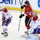 Ottawa Senators' Matt Kassian (28) watches as Montreal Canadiens' Andrei Markov blocks a shot in front Canadiens goaltender Carey Price (31) during the first period of Game 4 of an NHL hockey Stanley Cup playoff series in Ottawa, Ontario, on Tuesday, May 7, 2013. (AP Photo/The Canadian Press, Fred Chartrand)