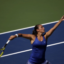Roberta Vinci, of Italy, serves against Shuai Peng, of China, during the third round of the 2014 U.S. Open tennis tournament, Friday, Aug. 29, 2014, in New York. (AP Photo/Frank Franklin II)