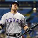 Texas Rangers' Josh Hamilton reacts after striking out during the first inning of a baseball game against the Tampa Bay Rays in St. Petersburg, Fla., Sunday, Sept. 9, 2012. (AP Photo/Phelan M. Ebenhack)