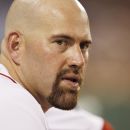 BOSTON, MA - June 21:  Kevin Youkilis #20 of the Boston Red Sox, who was not in the starting lineup, looks on from the dugout during the fifth inning of the game against the Miami Marlins at Fenway Park on June 21, 2012 in Boston, Massachusetts.  (Photo by Winslow Townson/Getty Images)