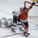 Chicago Blackhawks center Patrick Sharp (10) reacts after scoring a goal against Los Angeles Kings goalie Jonathan Quick (32) during the second period in Game 1 of the NHL hockey Stanley Cup Western Conference finals Saturday, June 1, 2013, in Chicago. (AP Photo/Charles Rex Arbogast)