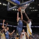 OAKLAND, CA - NOVEMBER 24: Kevin Love #42 of the Minnesota Timberwolves dunks the ball against Festus Ezeli #31 of the Golden State Warriors on November 24, 2012 at Oracle Arena in Oakland, California. (Photo by Rocky Widner/NBAE via Getty Images)