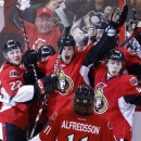 Ottawa Senators' Erik Condra, left, Colin Greening, center, Jean-Gabriel Pageau, right, and Daniel Alfredsson celebrate after Greening scores the winning goal against the Pittsburgh Penguins during the second overtime period of Game 4 of their Stanley Cup Eastern Conference semi-final NHL hockey series at Scotiabank Place in Ottawa on Sunday, May 19, 2013. (AP Photo/The Canadian Press, Patrick Doyle)