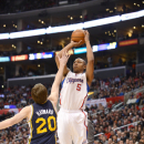 LOS ANGELES, CA - DECEMBER 30:  Caron Butler #5 of the Los Angeles Clippers goes for a jump shot against Gordon Hayward #20 of the Utah Jazz during the game between the Los Angeles Clippers and the Utah Jazz at Staples Center on December 30, 2012 in Los Angeles, California. (Photo by Noah Graham/NBAE via Getty Images)