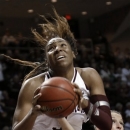 Mississippi's Gracie Frizzell, right, tries to reach around Texas A&M 's Kelsey Bone, front, for the ball during the first half of an NCAA college basketball game Thursday, Feb. 21, 2013, in College Station, Texas. (AP Photo/Pat Sullivan)