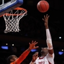 Temple's Anthony Lee (3) shoots over Syracuse's James Southerland during the first half of an NCAA college basketball game in the Gotham Classic at Madison Square Garden, Saturday, Dec. 22, 2012, in New York. (AP Photo/Jason Decrow)