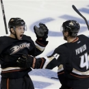 Anaheim Ducks center Nick Bonino, left, celebrates his game winning goal with Cam Fowler, against the Detroit Red Wings during overtime in Game 5 of their first-round NHL hockey Stanley Cup playoff series in Anaheim, Calif., Wednesday, May 8, 2013.  The Ducks won 3-2 in overtime.(AP Photo/Chris Carlson)