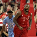 North Carolina State's Richard Howell (1) celebrates a basket ahead of North Carolina's Desmond Hubert (14) during the first half of an NCAA college basketball game in Raleigh, N.C., Saturday, Jan. 26, 2013.  N.C. State won 91-83.  (AP Photo/Ted Richardson)