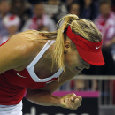 Maria Sharapova of Russia makes a fist during her match against Agnieszka Radwanska of Poland during the Fed Cup World Group first round tennis match between Poland and Russia in Krakow, Poland, Sunday, Feb. 8, 2015. (AP Photo/Czarek Sokolowski)