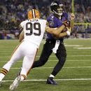 Baltimore Ravens quarterback Joe Flacco (5) carries the ball past Cleveland Browns outside linebacker Scott Fujita into the end zone for a touchdown during the second half of an NFL football game in Baltimore, Thursday, Sept. 27, 2012. (AP Photo/Patrick Semansky)