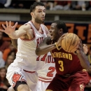Cleveland Cavaliers guard Dion Waiters (3) goes against Chicago Bulls forward Vladimir Radmanovic (77) during the second half of an NBA preseason basketball game Friday, Oct. 12, 2012, in Champaign, Ill. Cleveland defeated Chicago 86-83. (AP Photo/Seth Perlman)