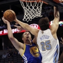 Golden State Warriors forward David Lee (10) shoots against Denver Nuggets center Timofey Mozgov, of Russia, in the first quarter of their preseason NBA basketball game, Monday, Oct. 15, 2012, in Denver. (AP Photo/Joe Mahoney)