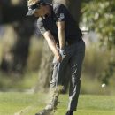 Luke Donald, of England, hits a shot on the 14th hole during the first round of the U.S. Open Championship golf tournament Thursday, June 14, 2012, at The Olympic Club in San Francisco. (AP Photo/Charlie Riedel)