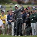 Tiger Woods of the U.S. hits a second shot out of the crowd on the 10th hole during the third round of the Memorial Tournament at Muirfield Village Golf Club in Dublin, Ohio June 2, 2012. REUTERS/John Sommers II
