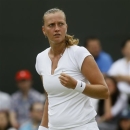 Petra Kvitova of the Czech Republic reacts after winning a point against Carla Suarez Navarro of Spain in a Women's singles match at the All England Lawn Tennis Championships in Wimbledon, London, Monday, July 1, 2013. (AP Photo/Kirsty Wigglesworth)