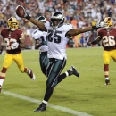 Philadelphia Eagles running back LeSean McCoy celebrates has he crosses the goal line for a touchdown during the second half of an NFL football game against the Washington Redskins in Landover, Md., Monday, Sept. 9, 2013. (AP Photo/Nick Wass)