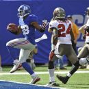 New York Giants wide receiver Hakeem Nicks (88) runs past Tampa Bay Buccaneers strong safety Mark Barron (24) for a touchdown during the first half of an NFL football game on Sunday, Sept. 16, 2012, in East Rutherford, N.J. (AP Photo/Bill Kostroun)