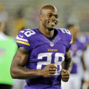 FILE - In this Aug. 8, 2014, file photo, Minnesota Vikings running back Adrian Peterson leaves the field after an NFL preseason football game against the Oakland Raiders in Minneapolis. The Minnesota Vikings will open their optional team practices this week without Peterson. The star running back has told coach Mike Zimmer that he will not attend the three days of team work that begin Tuesday, a person with knowledge of the situation told The Associated Press on Sunday, May 24, 2015. The person requested anonymity because he was not authorized to speak publicly on the issue. (AP Photo/Jim Mone, File)
