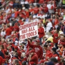 A fan holds up a sign during the fourth inning of Game 3 of baseball's National League championship series between the St. Louis Cardinals and the San Francisco Giants, Wednesday, Oct. 17, 2012, in St. Louis. (AP Photo/Patrick Semansky)