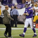 Minnesota Vikings quarterback Christian Ponder, right, is attended to by a trainer after an injury to his left shoulder during the second half of an NFL football game against the Washington Redskins, Thursday, Nov. 7, 2013, in Minneapolis. (AP Photo/Ann Heisenfelt)