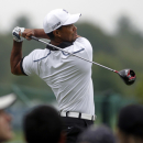 Tiger Woods tees of on the 12th tee during the pro-am round of the Deutsche Bank Championships in Norton, Mass., Thursday, Aug. 29, 2013. (AP Photo/Stew Milne)