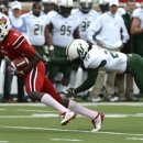 Louisville's DeVante Parker, left, outruns the grasp of South Florida's George Baker during action of their NCAA colege football game Saturday Oct. 20, 2012 in Louisville, Ky. Louisville defeated USF 27-25. (AP Photo/Timothy D. Easley)
