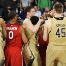 Notre Dame players Zach Auguste (2) Pat Crowley, middle, Cameron Biedscheid, middle right obscured, and Jack Cooley (45) scuffle with St. John's players including Jamal Branch (0) during the second half of an NCAA college basketball game Tuesday, March 5, 2013 in South Bend, Ind. Biedscheid and St. John's Sir'Dominic Pointer received technical fouls and were ejected from the game. Notre Dame won 66-40. (AP Photo/Joe Raymond)