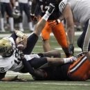 Pittsburgh quarterback Tino Sunseri is sacked by Syracuse's Brandon Sharpe during the first quarter of an NCAA college football game in Syracuse, N.Y., Friday, Oct. 5, 2012. (AP Photo/Kevin Rivoli)
