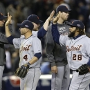 Detroit Tigers' Omar Infante (4) and Prince Fielder (28) celebrate with teammates after Detroit defeated the New York Yankees, 3-0, in Game 2 of the American League championship series Sunday, Oct. 14, 2012, in New York. (AP Photo/Paul Sancya )