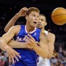 Los Angeles Clippers Blake Griffin (32) watches a loose ball with Denver Nuggets' JaVale McGee (34) defending during a NBA pre-season basketball game at the Mandalay Bay Events Center on Saturday, Oct. 6, 2012 in Las Vegas. (AP Photo/David Becker)