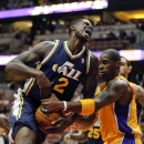 Utah Jazz's Marvin Williams, left, is fouled by Los Angeles Lakers' Antawn Jamison during the first half of an NBA preseason basketball game in Anaheim, Calif., Tuesday, Oct. 16, 2012. (AP Photo/Jae Hong)