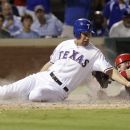 Texas Rangers' David Murphy, left, is tagged out at home plate by Los Angeles Angels catcher Bobby Wilson (46) during the seventh inning of a baseball game, Thursday, Aug. 2, 2012, in Arlington, Texas. The Rangers won 15-9. (AP Photo/LM Otero)