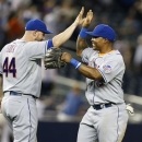 New York Mets right fielder Marlon Byrd, right, celebrates with catcher John Buck (44) after the the Mets defeated the New York Yankees 3-1 to complete a four game sweep after an interleague baseball game series at Yankee Stadium in New York, Thursday, May 30, 2013. (AP Photo/Kathy Willens)