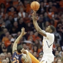 Illinois guard Brandon Paul, right, shoots against Auburn guard Frankie Sullivan during the first half of an NCAA college basketball game in Chicago, Saturday, Dec. 29, 2012. (AP Photo/Nam Y. Huh)