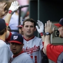 Washington Nationals' Ryan Zimmerman high-fives teammates after hitting a solo home run in the first inning of an interleague baseball game against the Baltimore Orioles, Wednesday, May 29, 2013, in Baltimore. (AP Photo/Patrick Semansky)