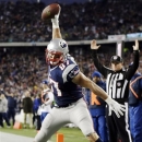 New England Patriots tight end Rob Gronkowski (87) spikes the ball after his touchdown catch against the Indianapolis Colts in the first quarter of an NFL football game at Gillette Stadium in Foxborough, Mass., Sunday, Nov. 18, 2012. (AP Photo/Michael Dwyer)